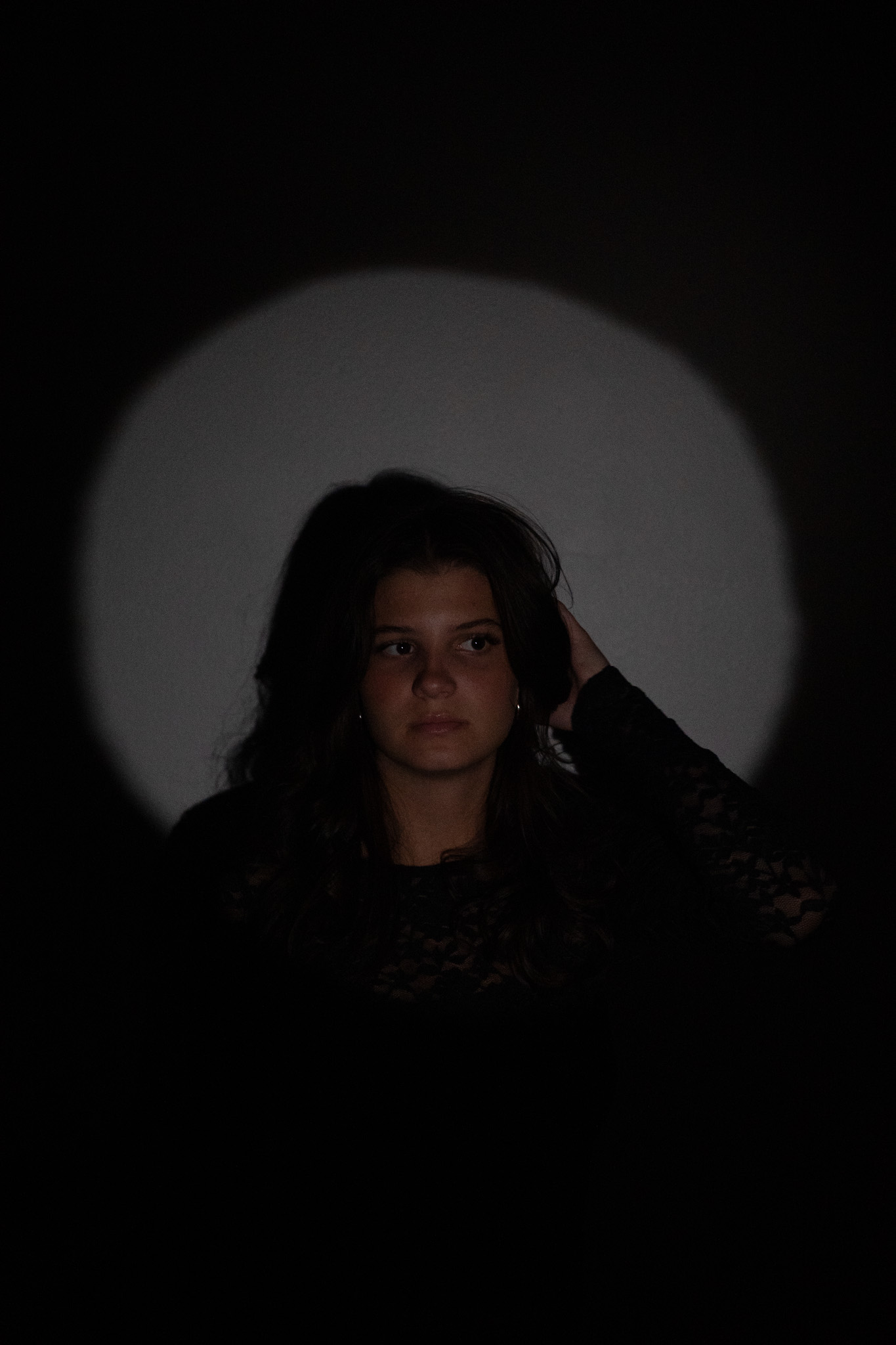 Creative studio self-portrait of a woman photographed indoors