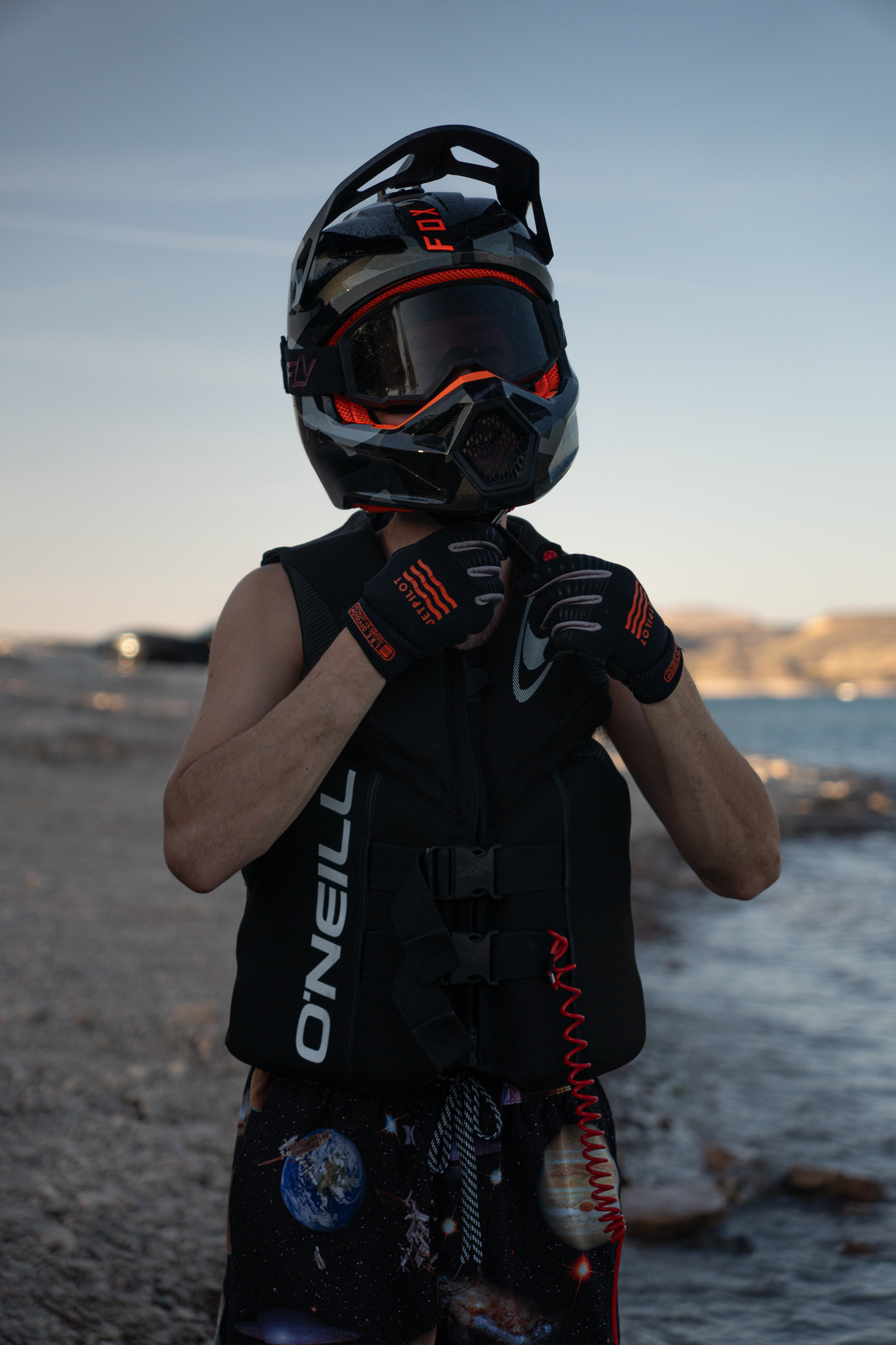 Man with a helmet for his jetski during a photo session at Lake Pleasant, Arizona